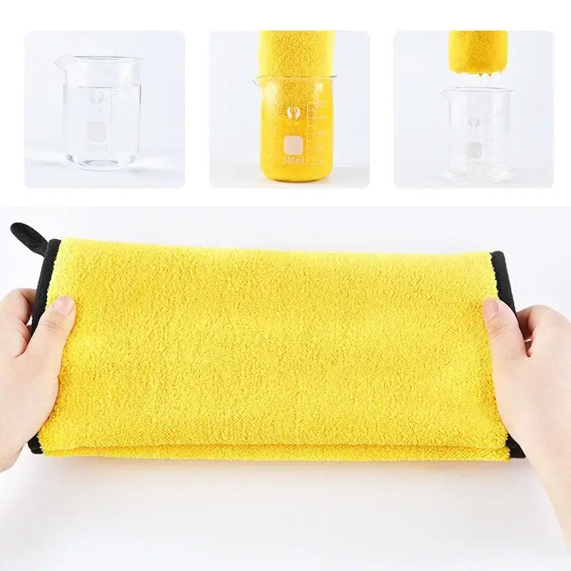 Bright yellow towel or cloth being held at both ends.