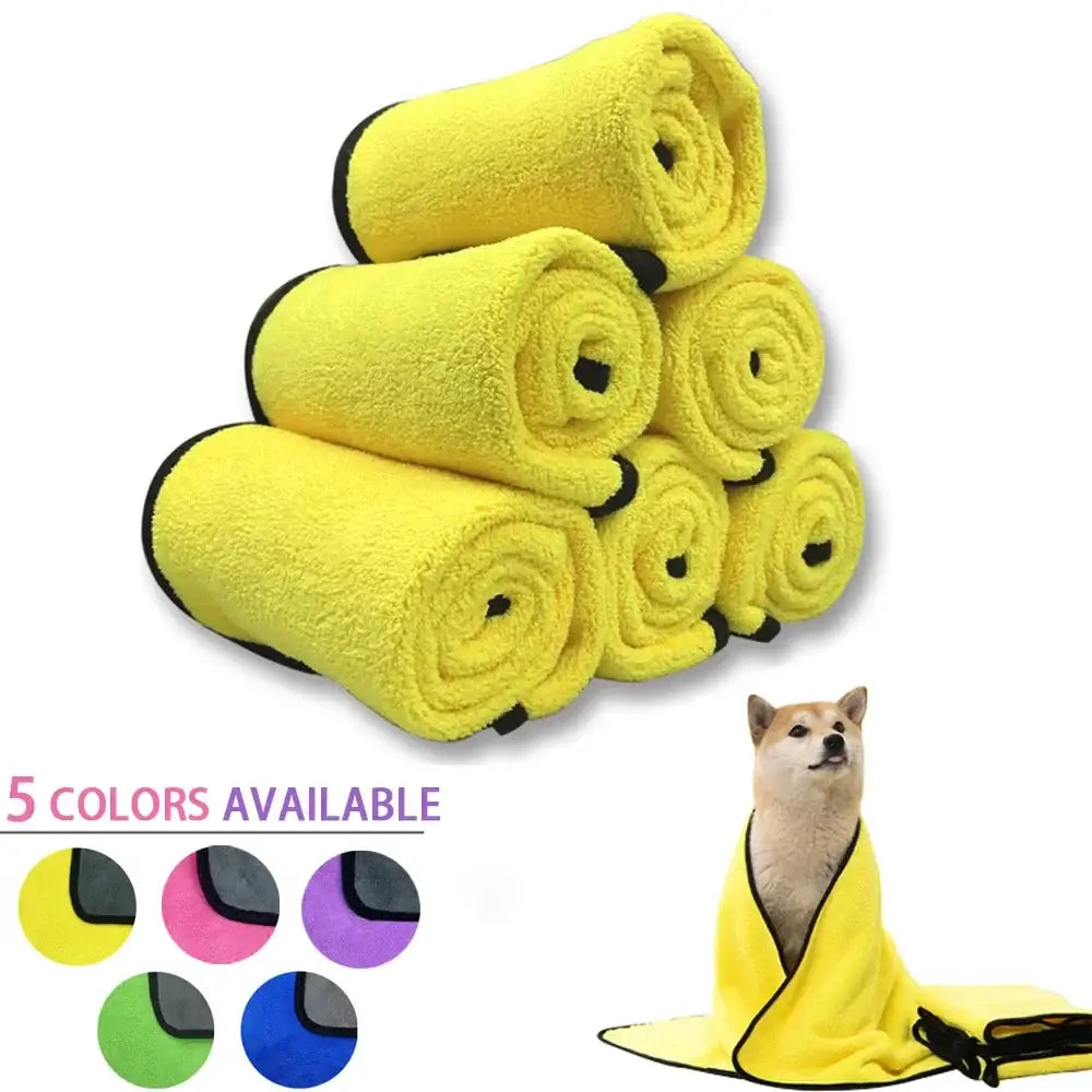 Stack of bright yellow microfiber towels or cloths rolled up.