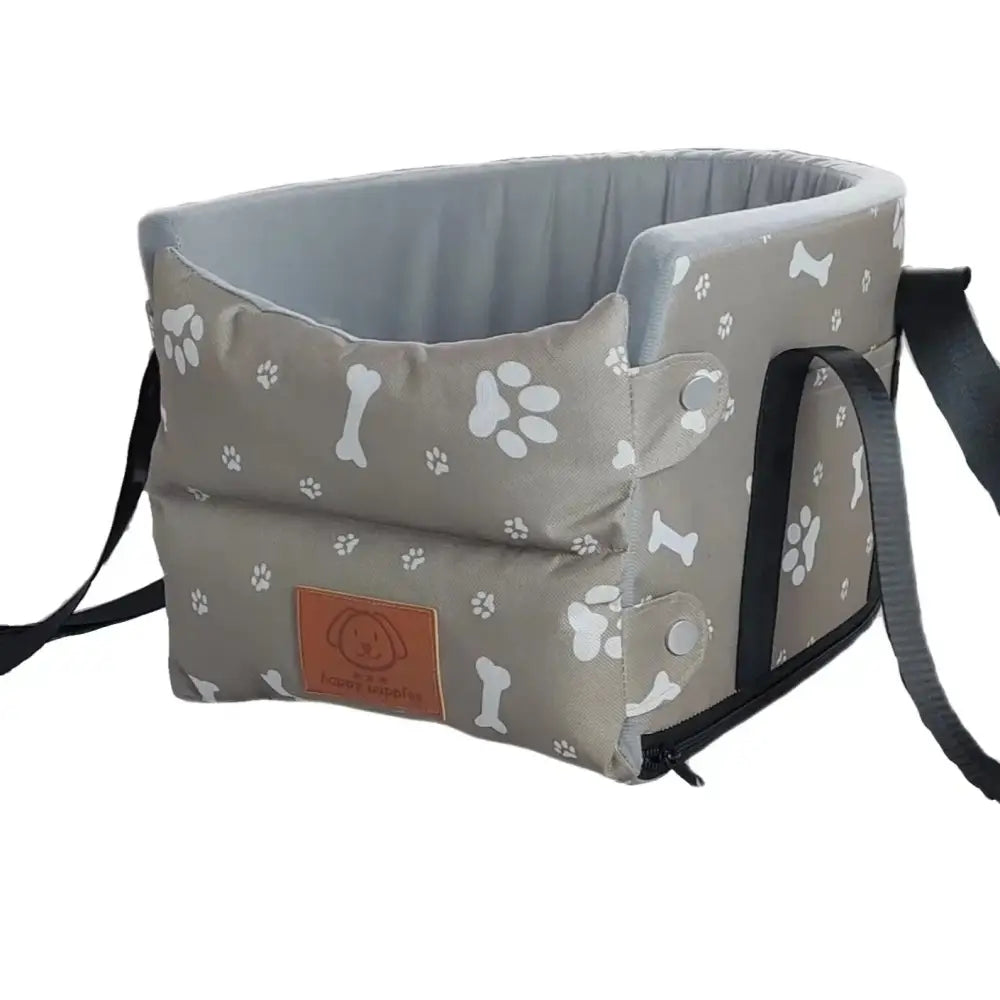 Pet carrier bag with paw print and bone pattern.