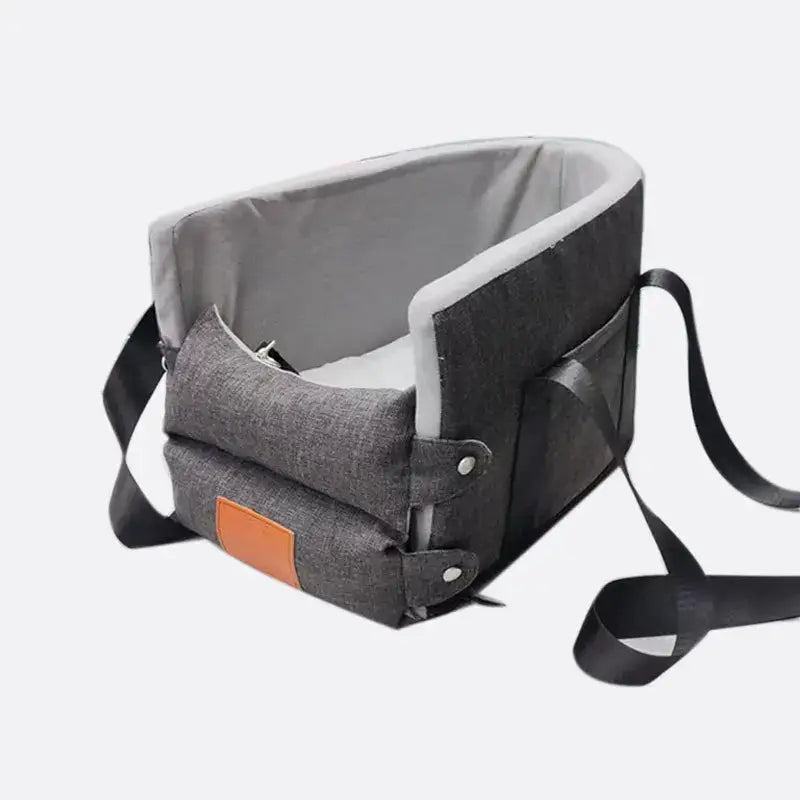 Pet carrier or travel bag with a structured frame and padded interior.