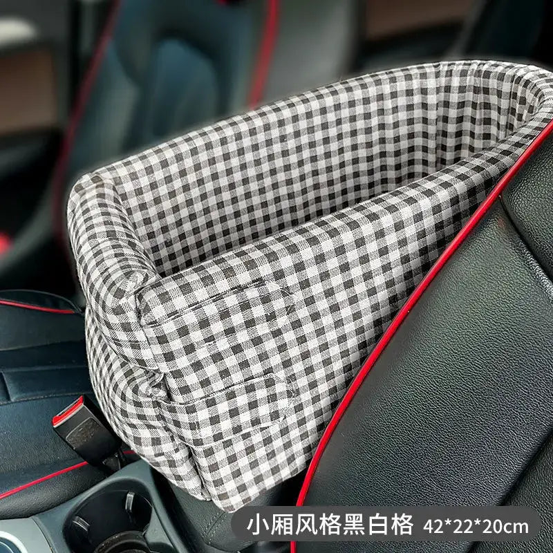 Plaid-patterned car seat cover or cushion with red trim.