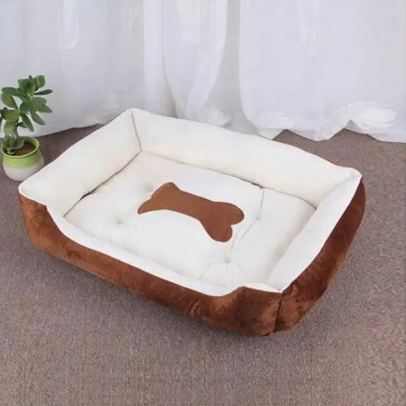 Dog bed with a bone-shaped design on the cushion.