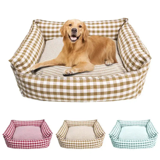 Golden Retriever lounging in a plaid-patterned dog bed.