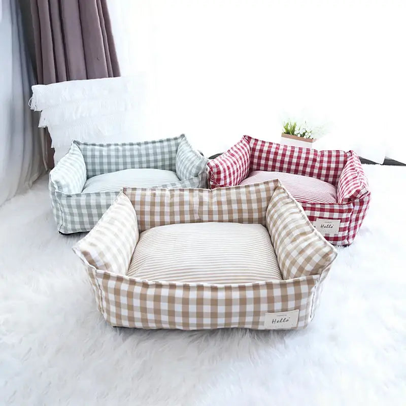 Plaid fabric pet beds in various colors and patterns.