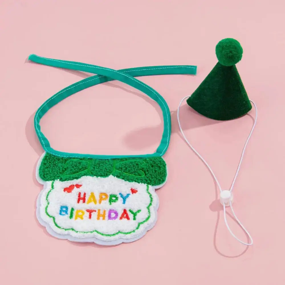 Birthday bib with colorful ’Happy Birthday’ text and a matching green party hat.