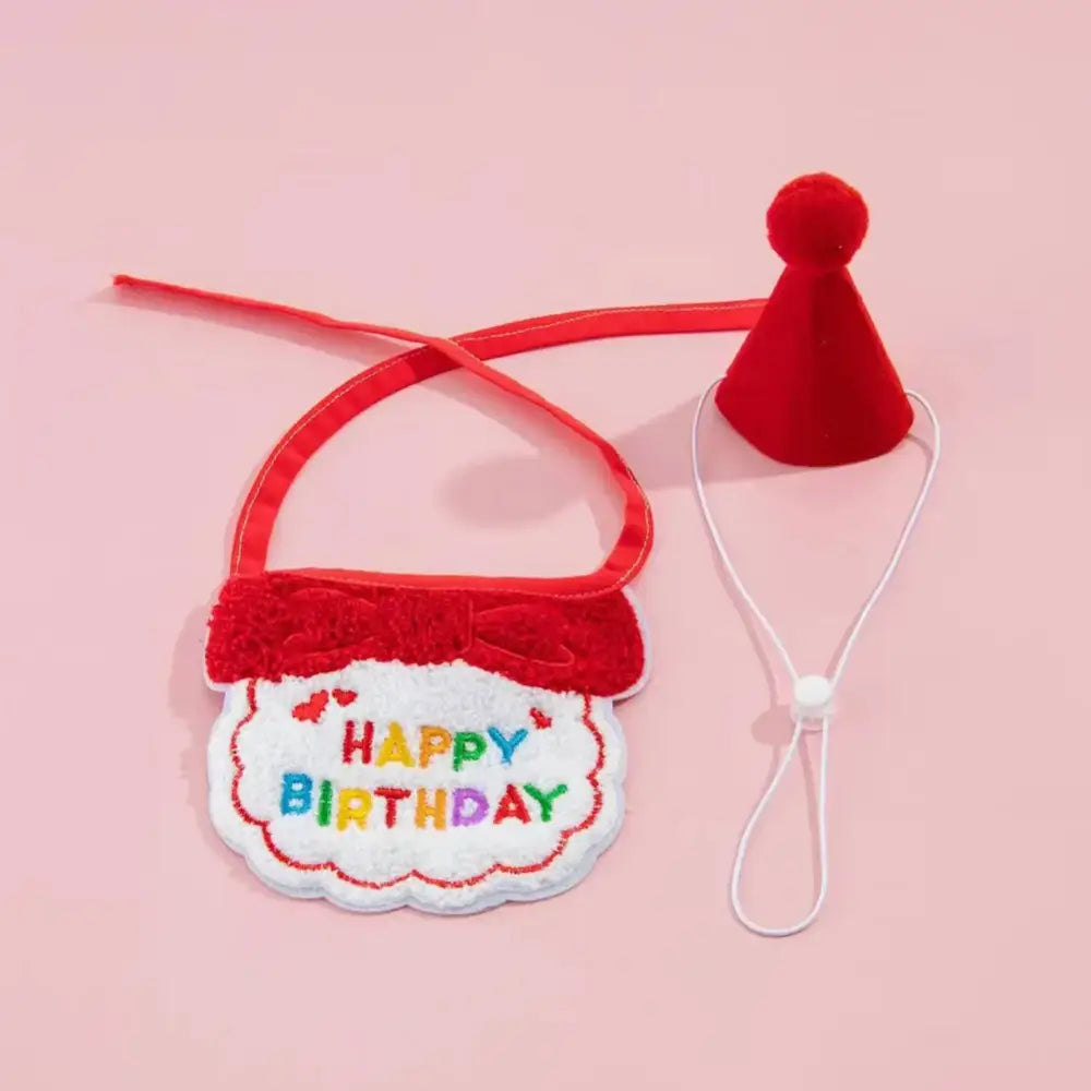 Birthday-themed bib with a colorful ’Happy Birthday’ message and a matching red party hat.