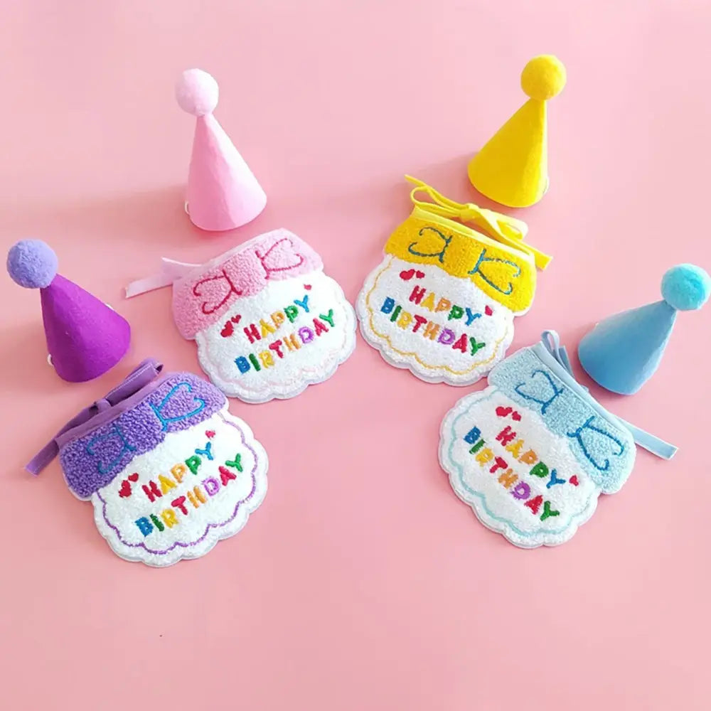 Colorful birthday badges with party hats attached.