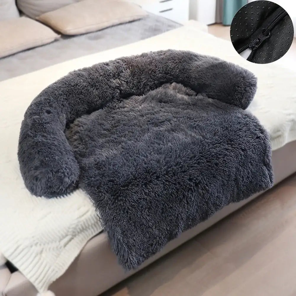 Plush, dark gray armchair with a curved, fluffy design.