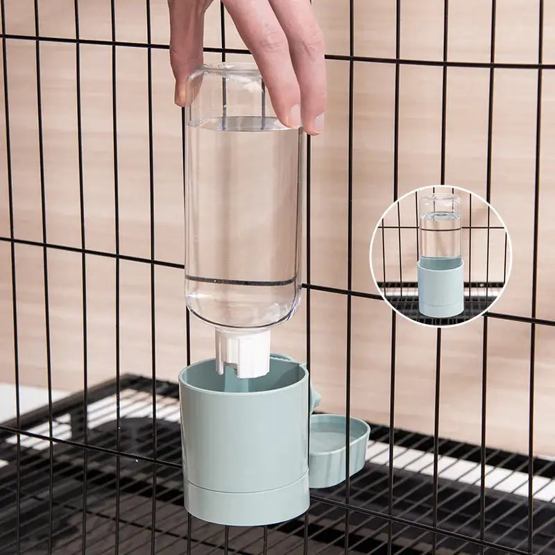 Automatic pet water dispenser with a transparent reservoir and mint green base.