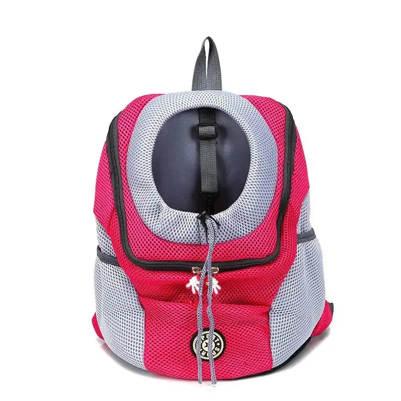 Pet carrier backpack with a mesh window and pink and gray color scheme.