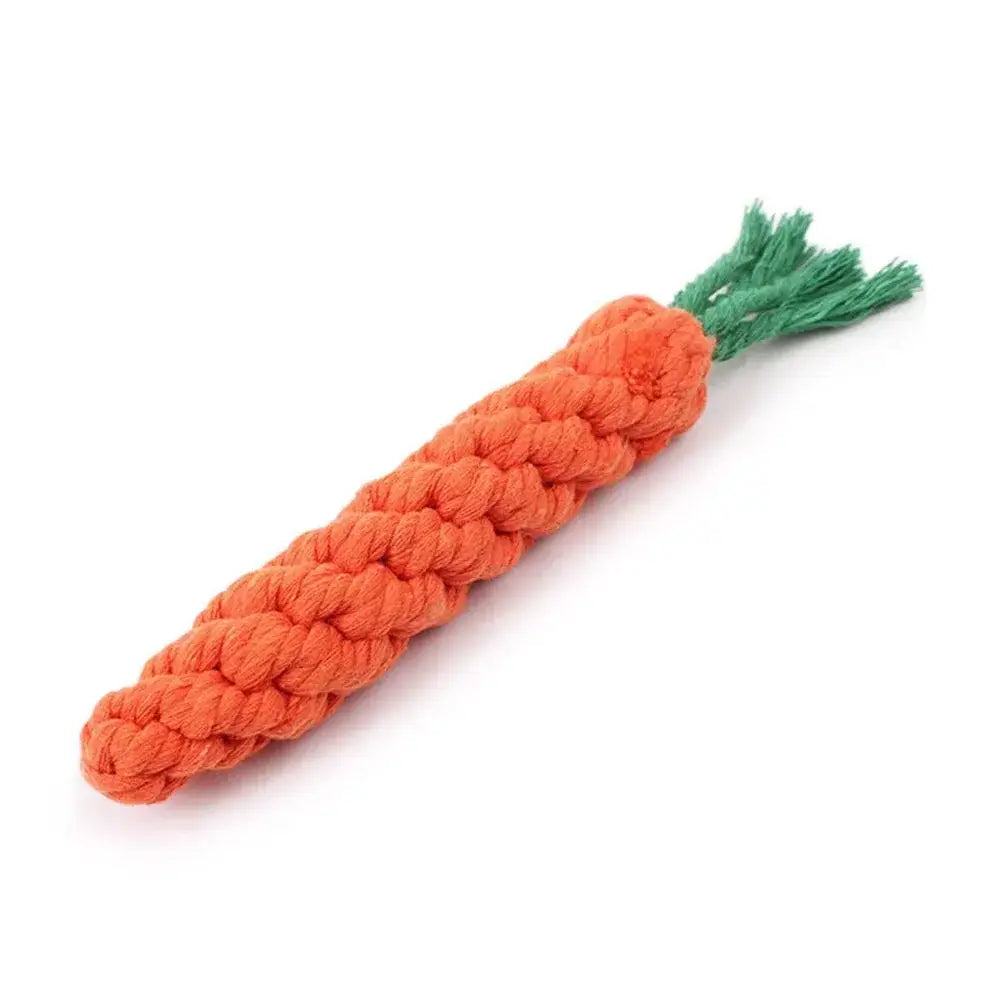 Carrot-shaped dog toy made of braided orange rope with green fabric leaves.