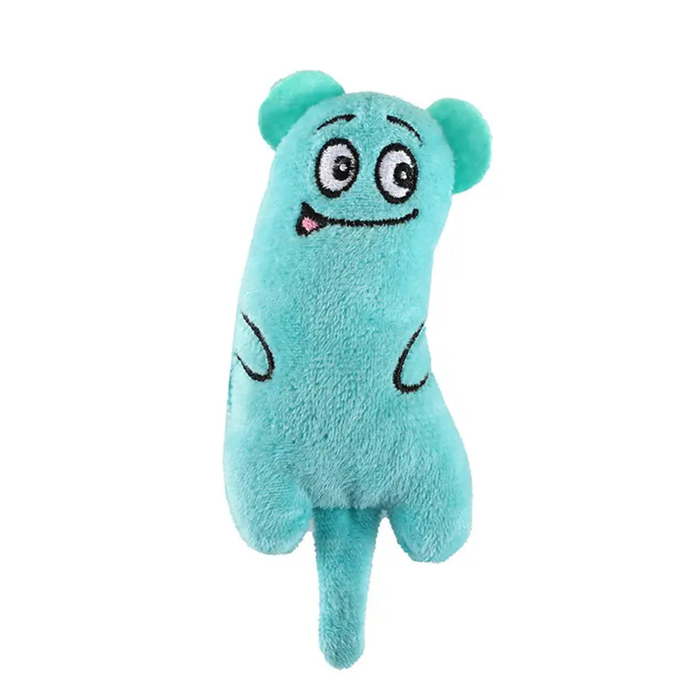 Turquoise plush toy monster with round ears and a goofy expression.