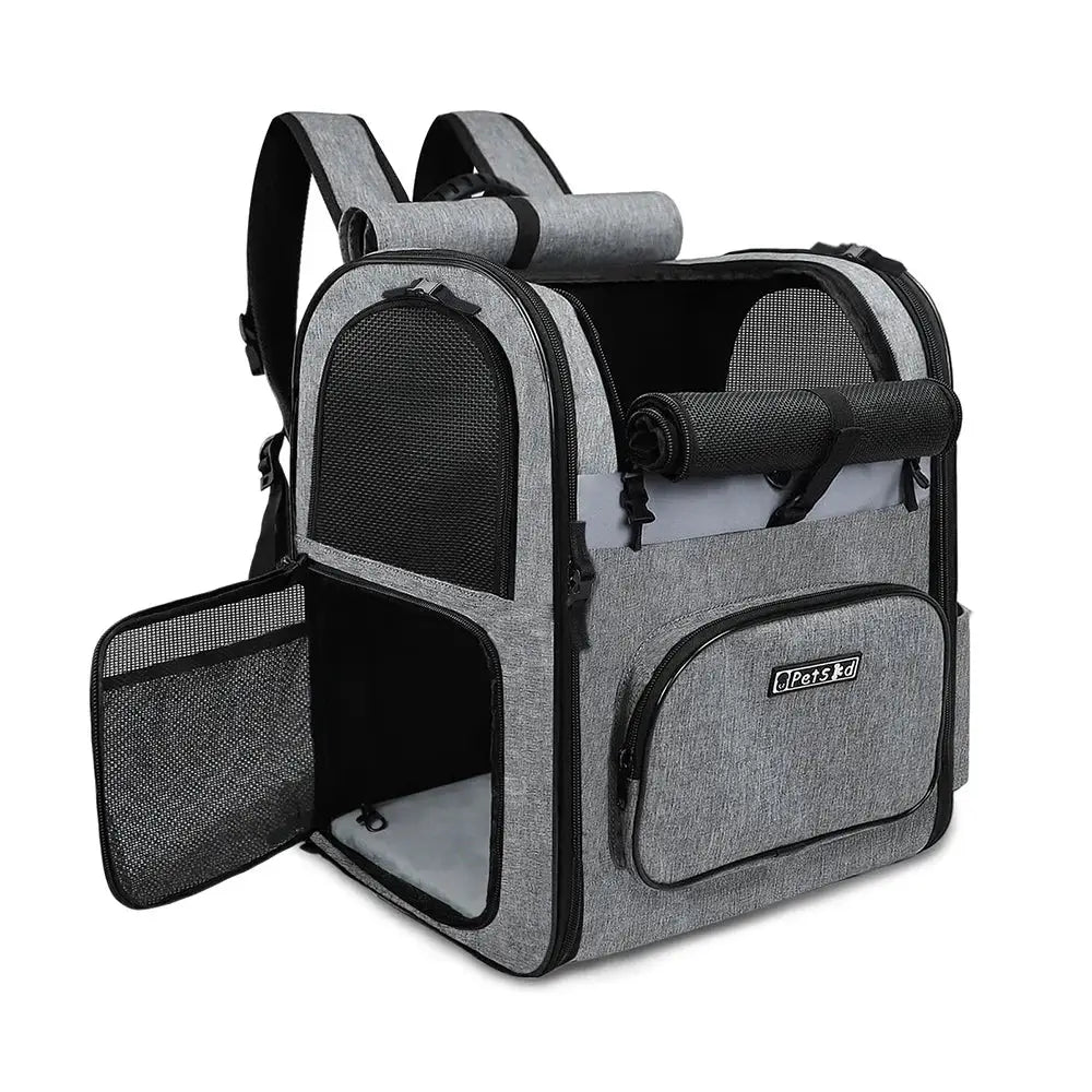 Pet carrier backpack with mesh panels and side pockets.