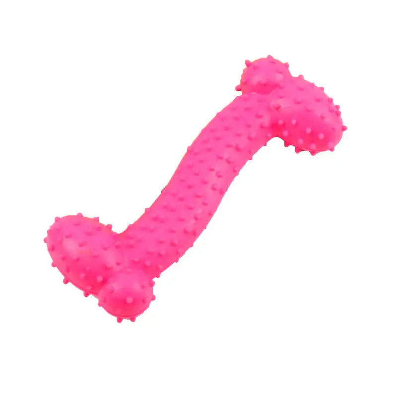 Bright pink rubber dog chew toy with textured nubs.