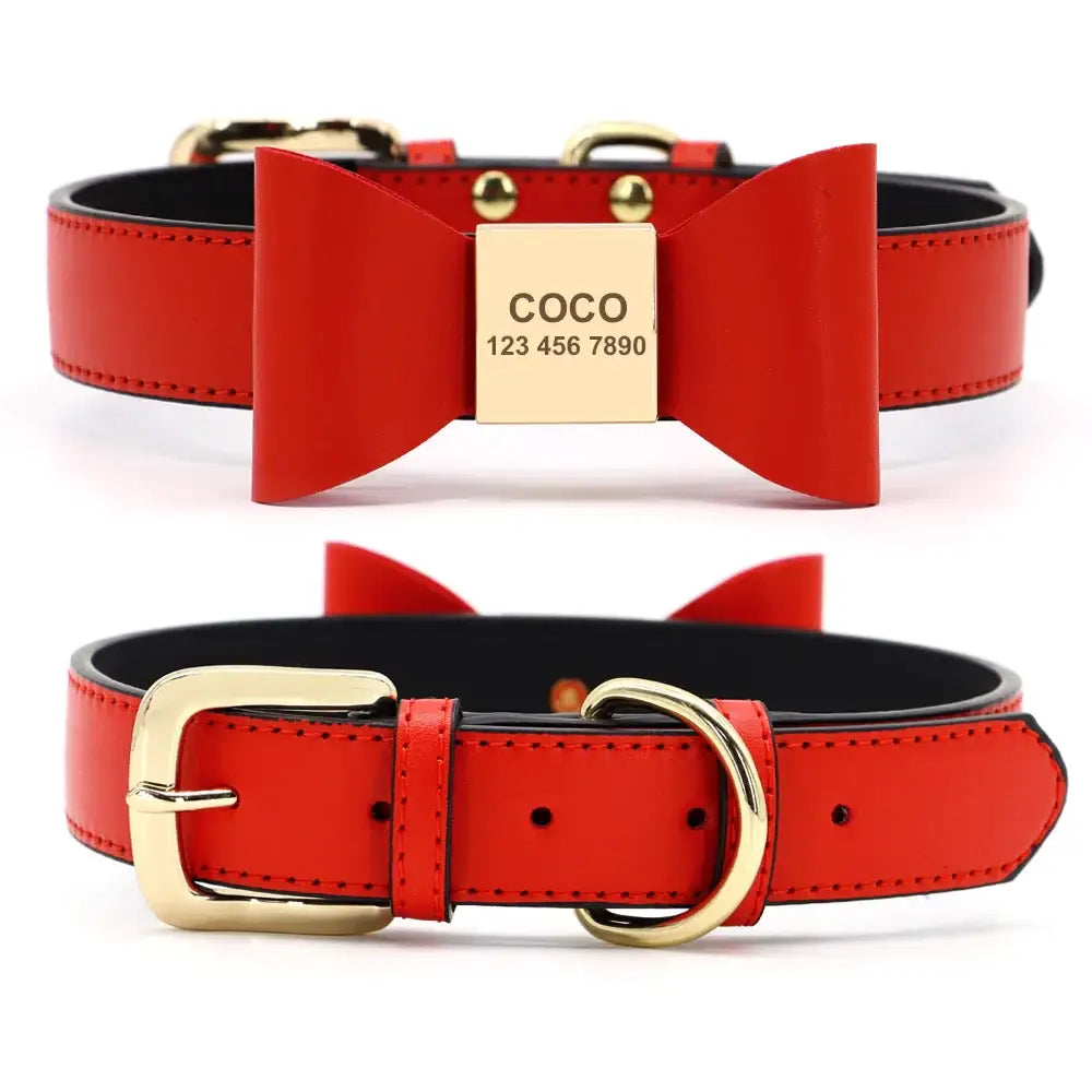 Red leather dog collar with a gold bow-shaped nameplate and buckle.