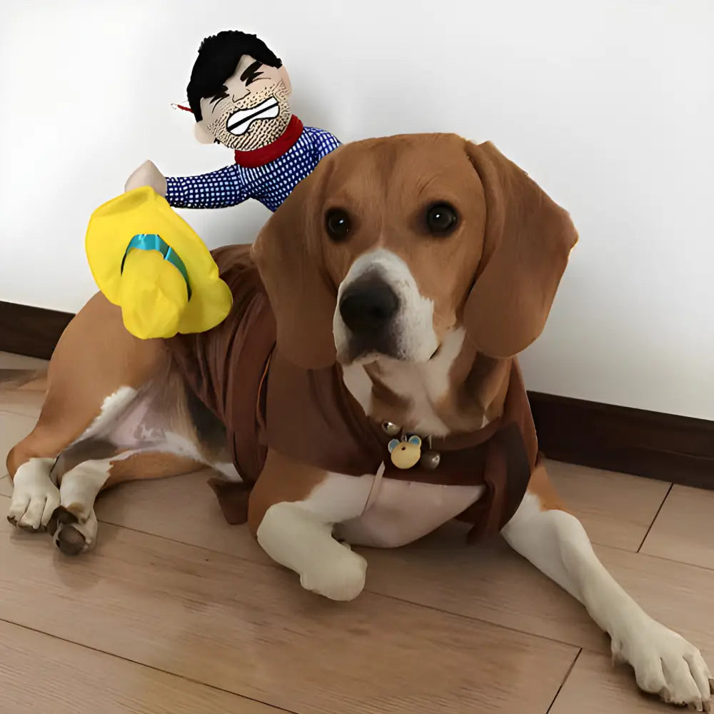 Beagle dog wearing a brown sweater with a toy figure on its back.