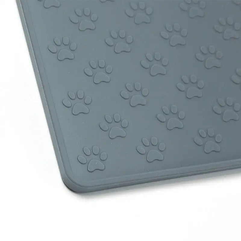 Gray rubber mat with embossed paw print patterns.