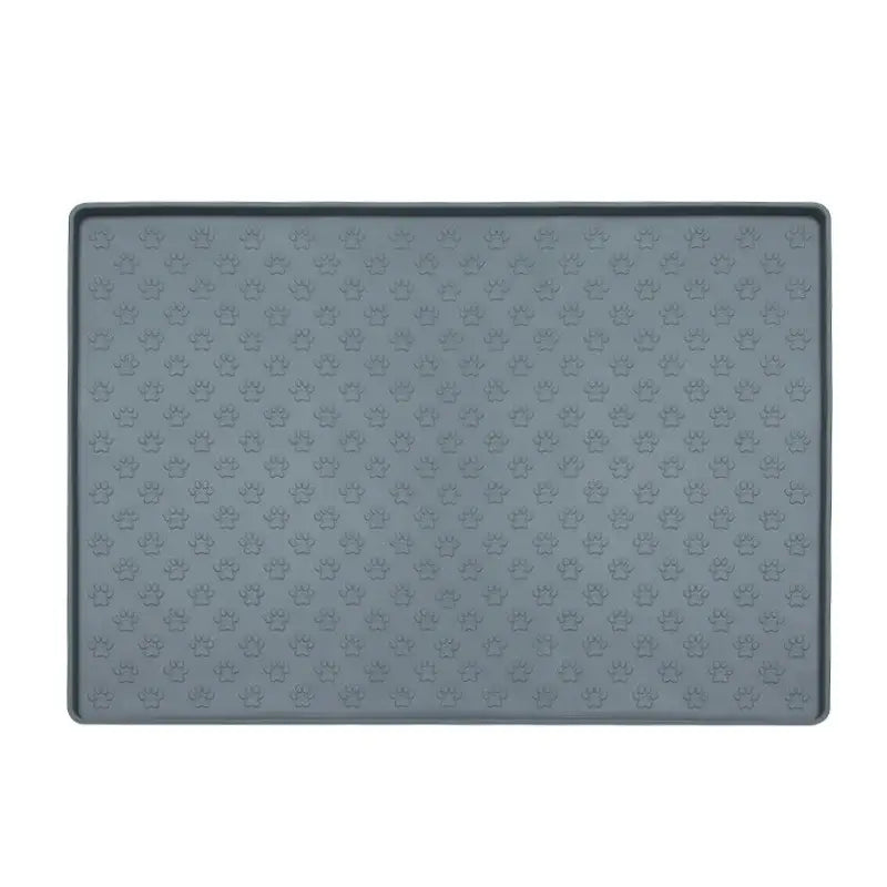 Gray silicone pet feeding mat with raised edges and textured surface.