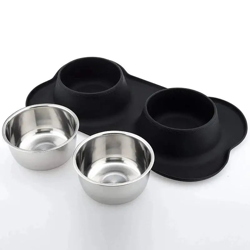 Pet feeding station with two stainless steel bowls set in a black silicone mat.