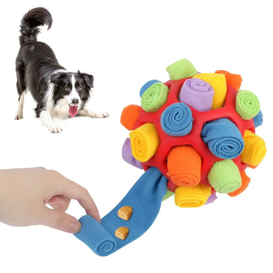 Colorful plush dog toy with rolled fabric pieces attached to a handle.