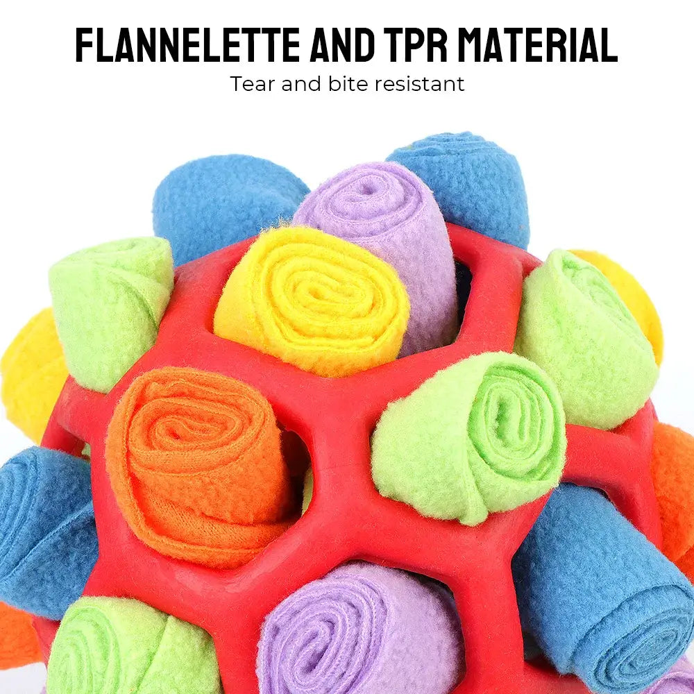 Colorful rolled fabric pieces arranged in a red honeycomb-shaped holder.