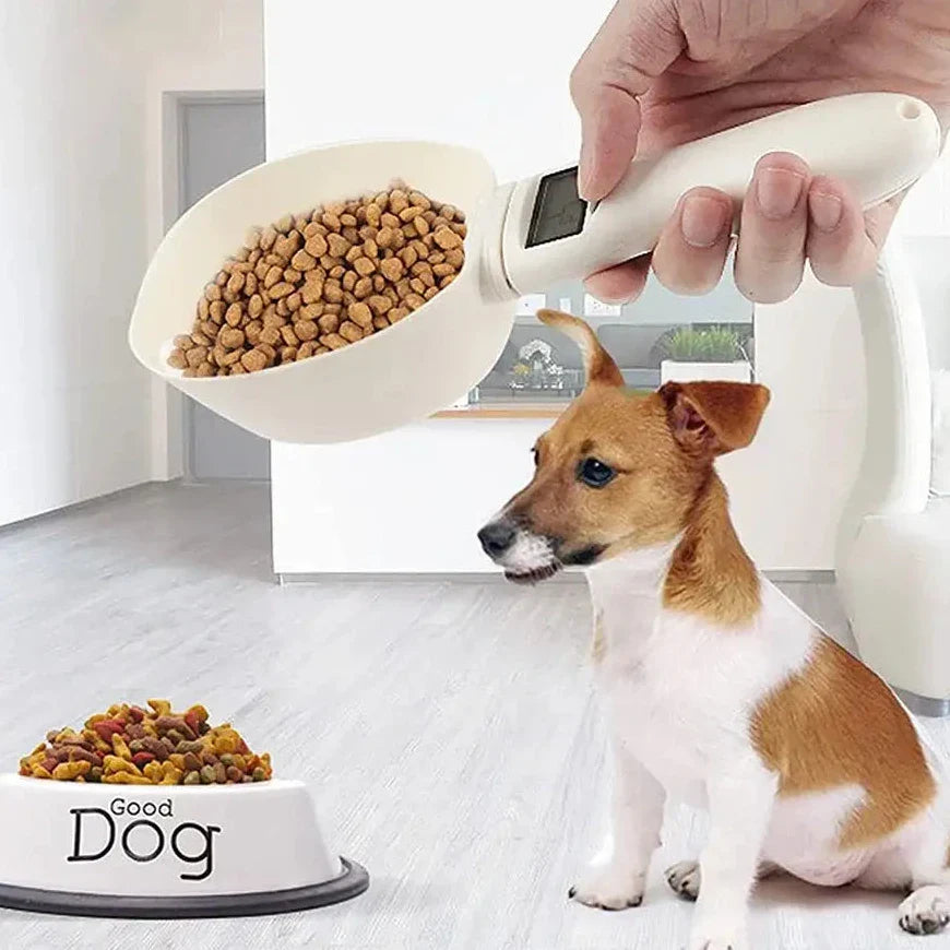 Scoop-shaped pet food measuring device being used to pour kibble into a dog’s bowl.