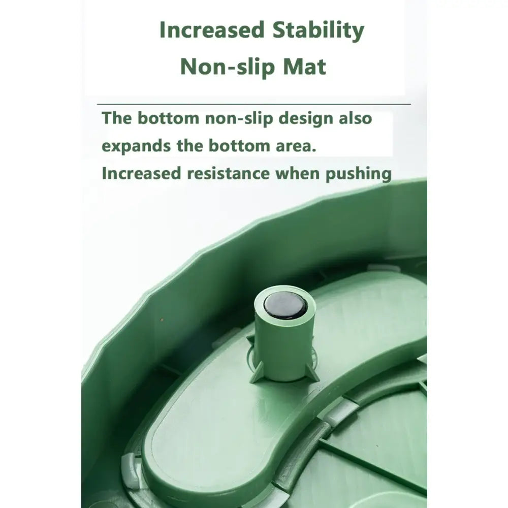 Green circular device with a central knob and curved edges, appearing to be a non-slip mat or base.