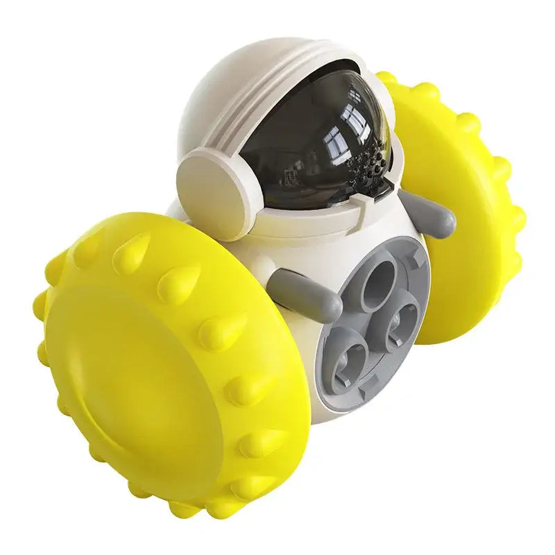 Toy robot with a round white body, black visor, and bright yellow wheels.