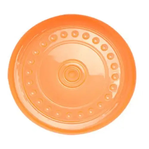 Orange plastic disc with circular patterns and indentations.