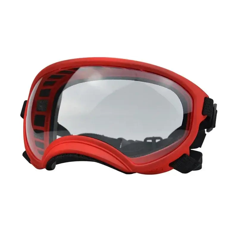 Red ski or snowboarding goggles with a clear lens.