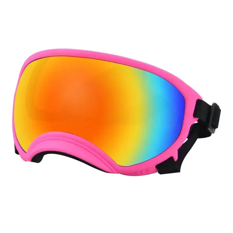 Ski or snowboard goggles with a pink frame and rainbow-colored mirrored lens.