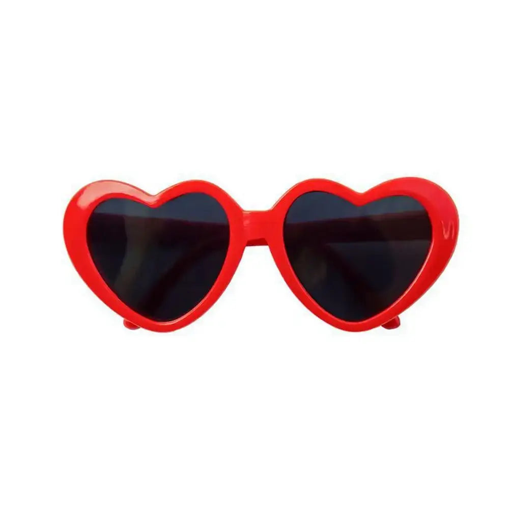 Heart-shaped red sunglasses with dark lenses.