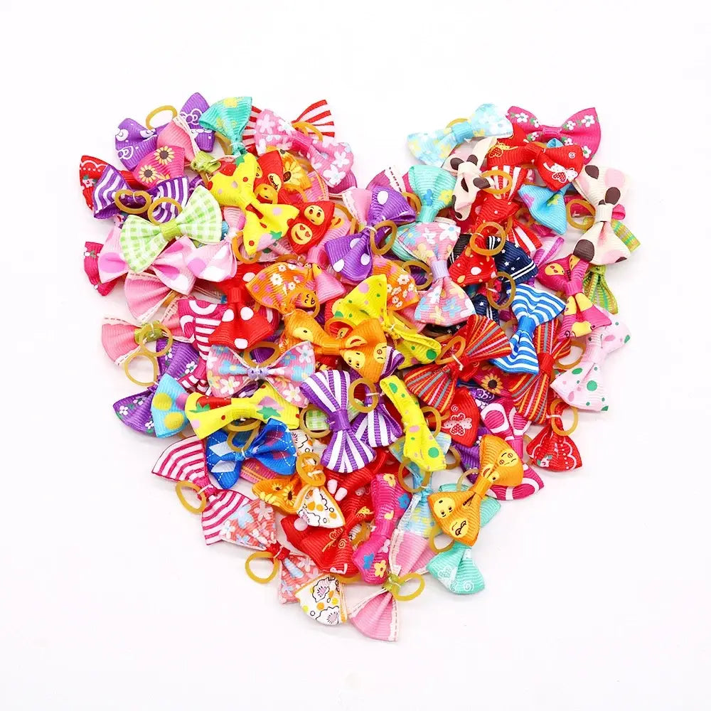 Heart-shaped arrangement of colorful hair bows and accessories.