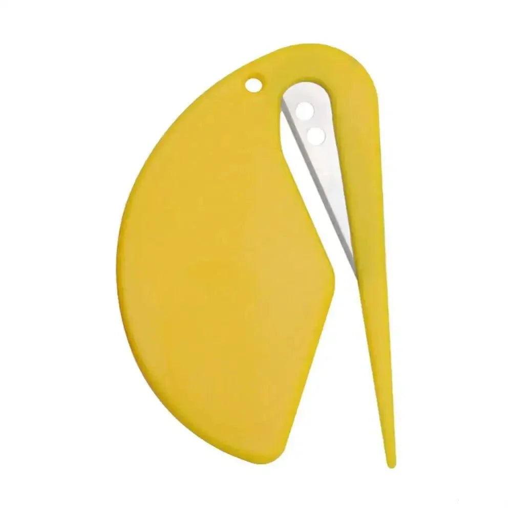 Yellow plastic letter opener shaped like a stylized bird or penguin.