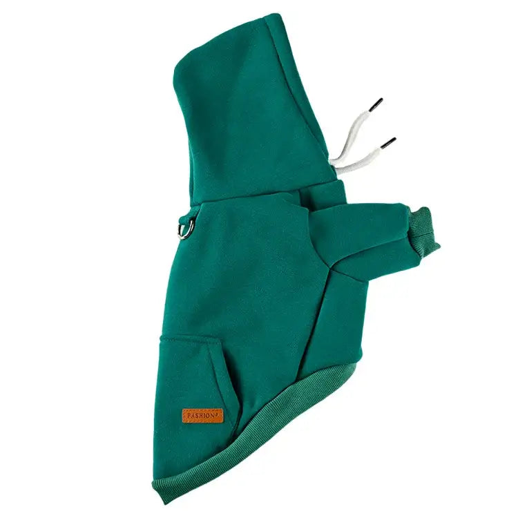 Green hooded dog coat with a harness-like strap.