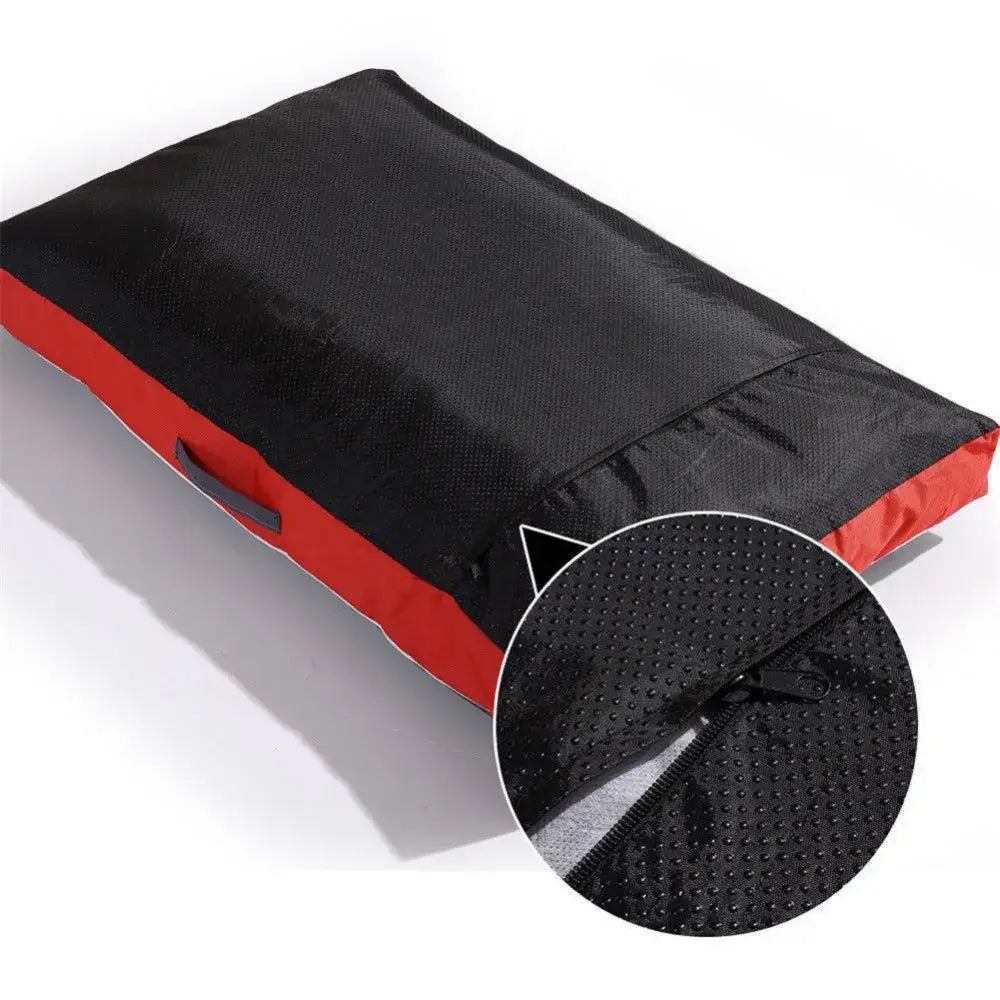 Black and red padded cushion or mat with a close-up detail of its textured surface.