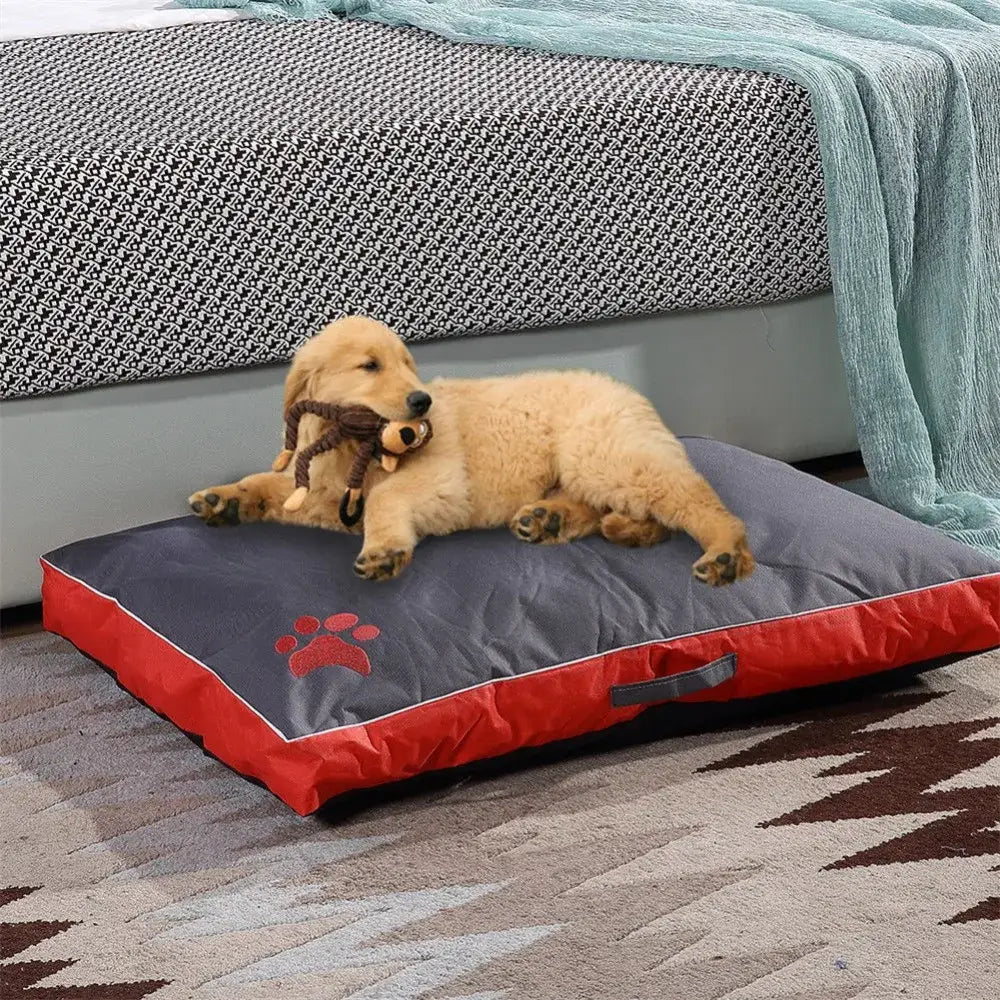 Golden retriever puppy lying on a dog bed.