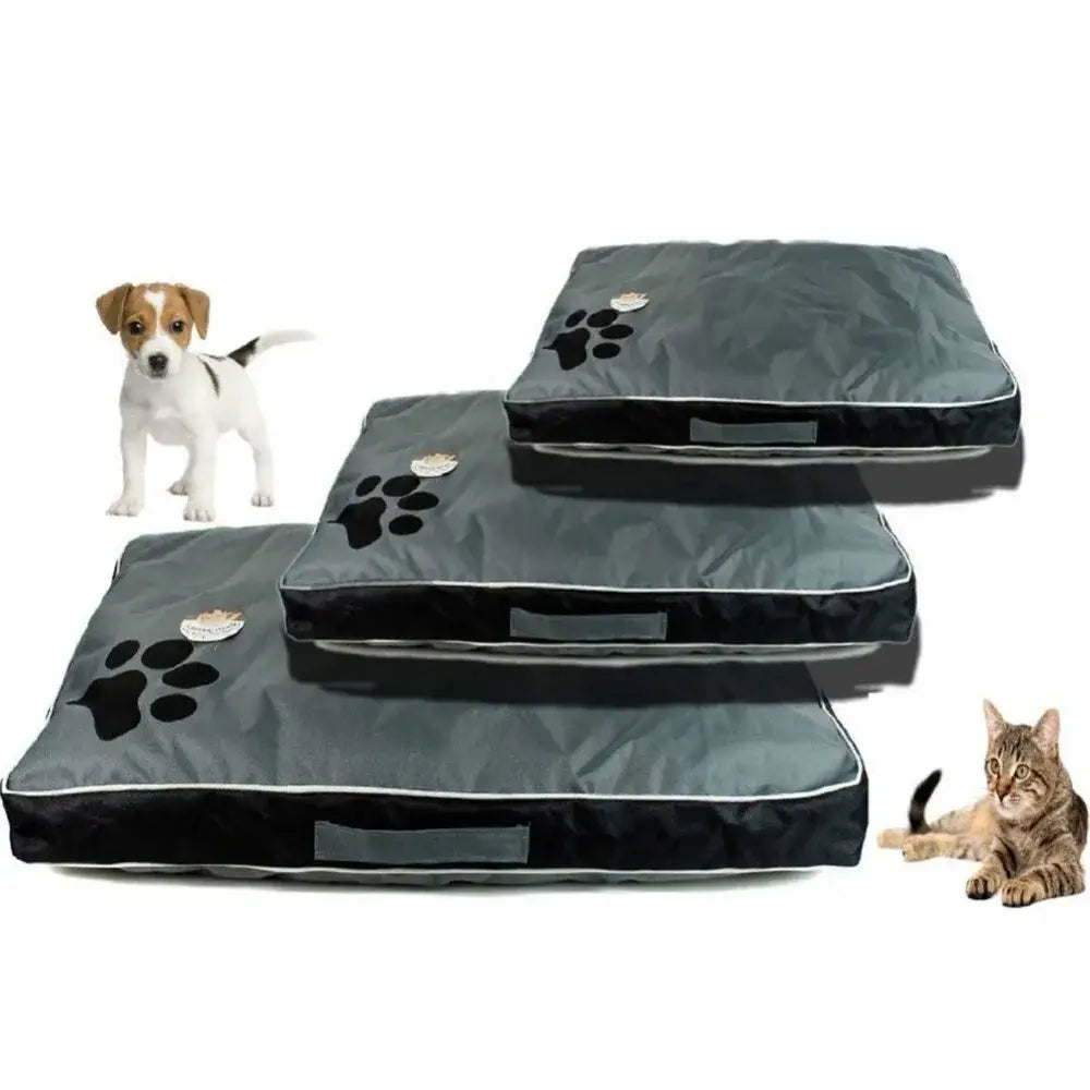 Pet beds with paw print designs in three different sizes.