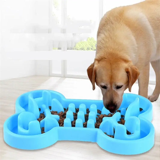 Blue bone-shaped dog food puzzle feeder with maze-like compartments.