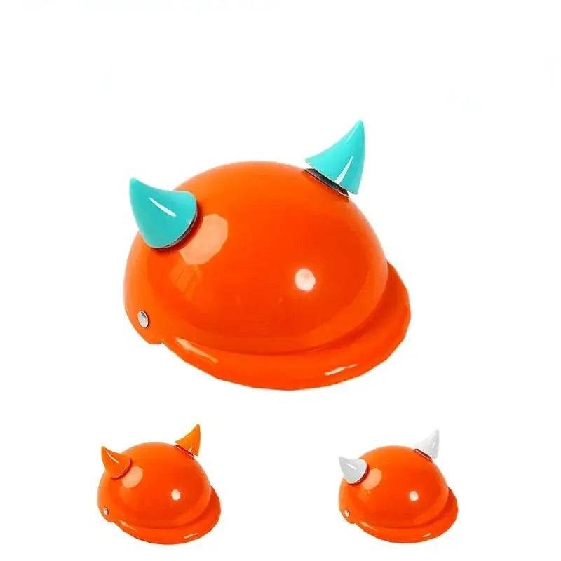 Orange helmet with two teal horns attached.