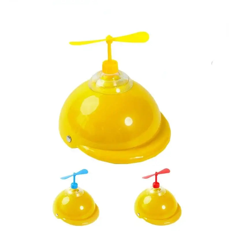 Yellow plastic helmet with a propeller on top.