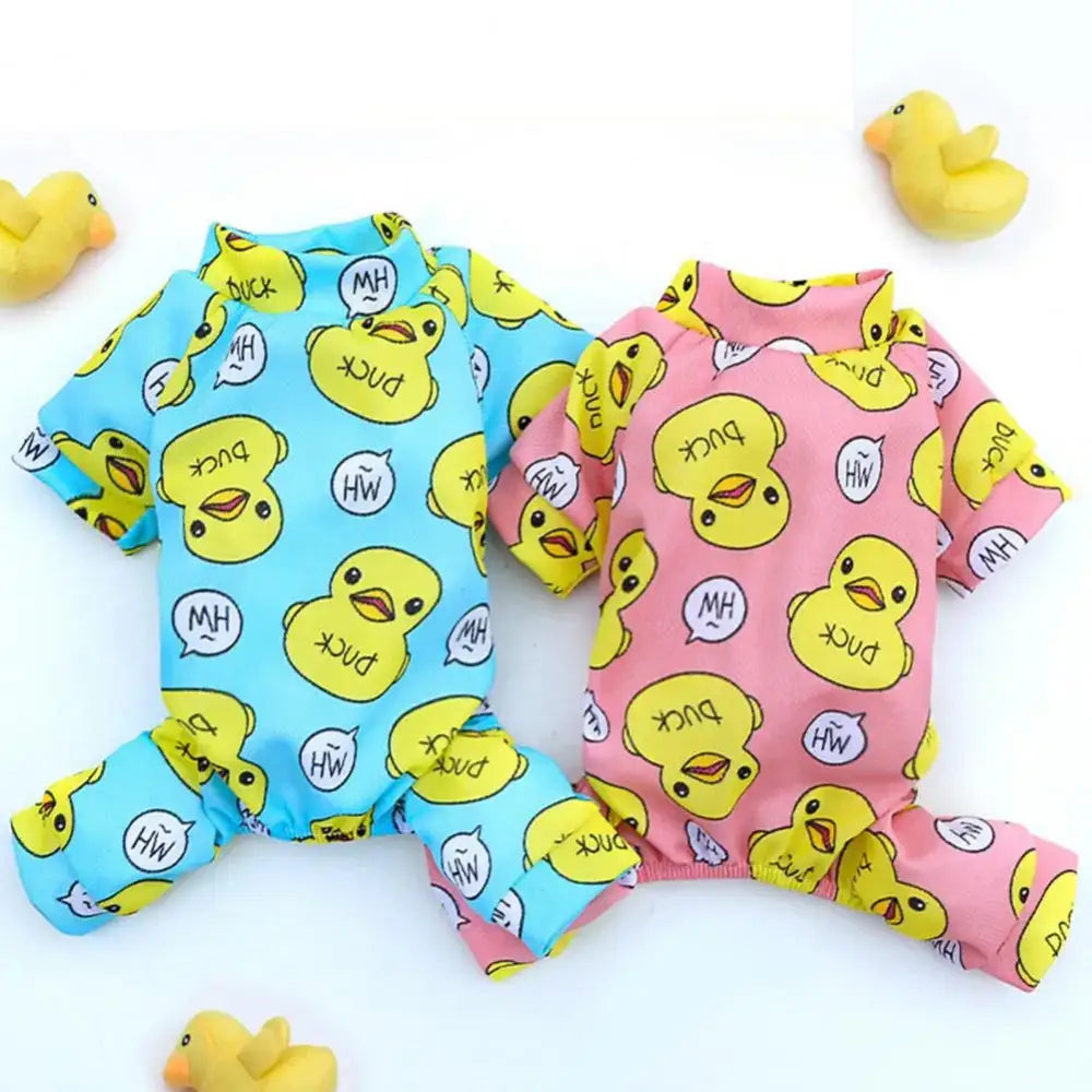 Two colorful dog pajamas with duck print patterns, one blue and one pink.