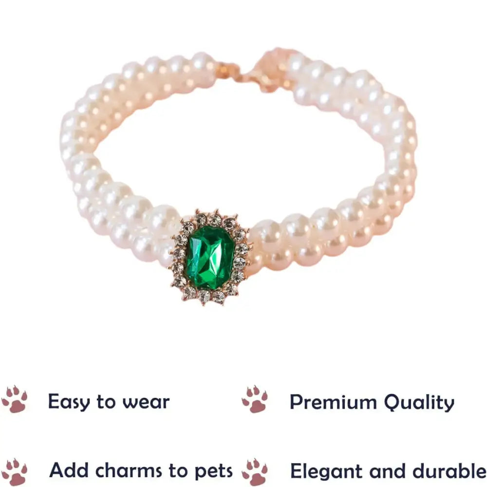 Pearl bracelet with a central emerald and diamond gemstone cluster.