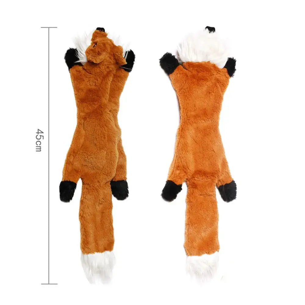 Plush fox toy with elongated body and contrasting black paws and white tail tip.