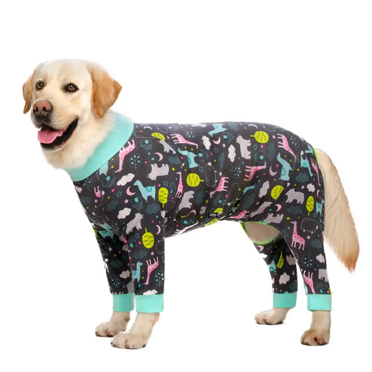 Yellow Labrador retriever wearing a colorful patterned onesie with animal designs.