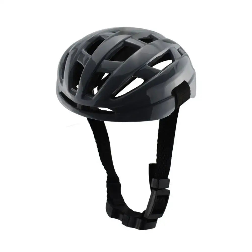 Matte black bicycle helmet with ventilation holes and adjustable straps.