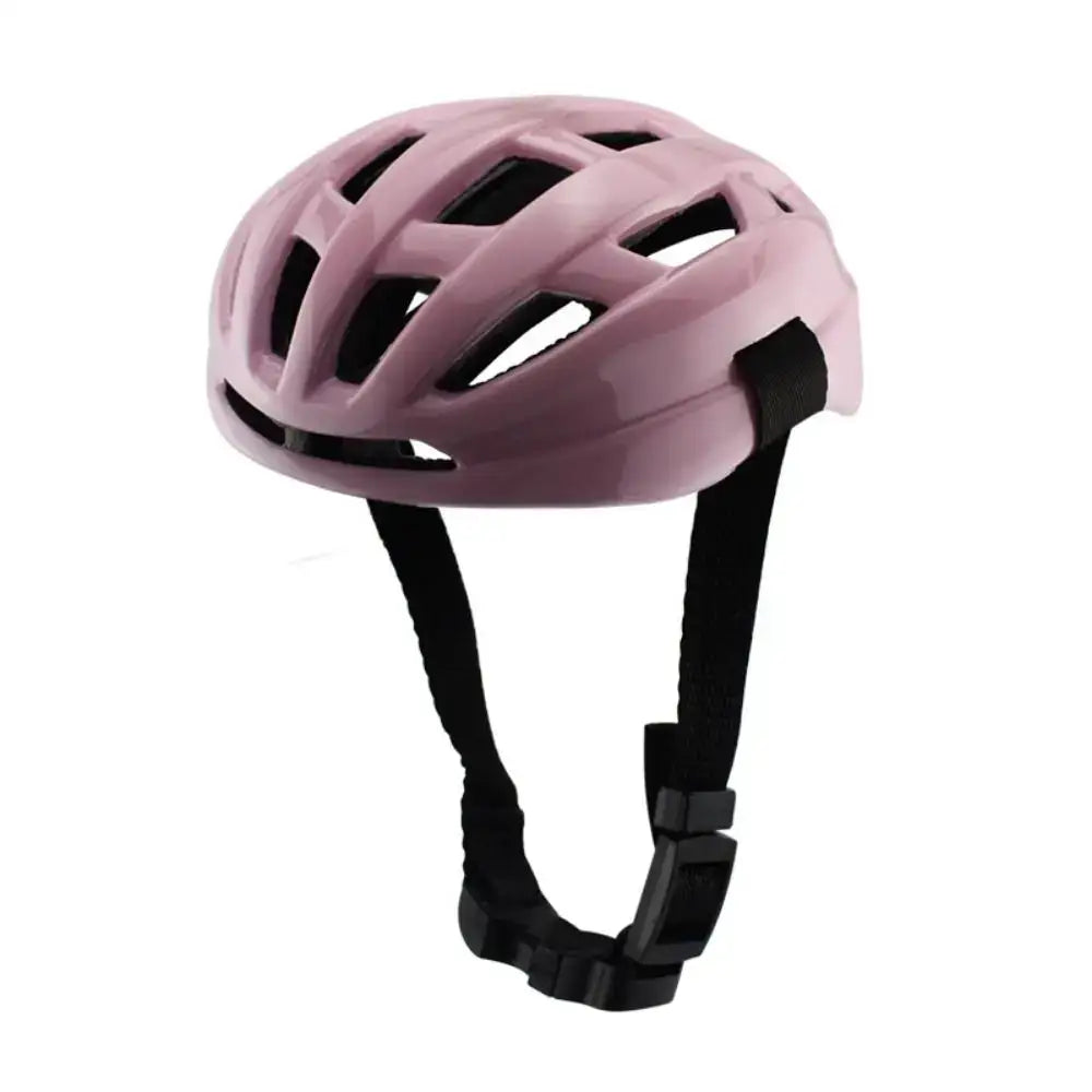 Pink bicycle helmet with ventilation holes and black straps.