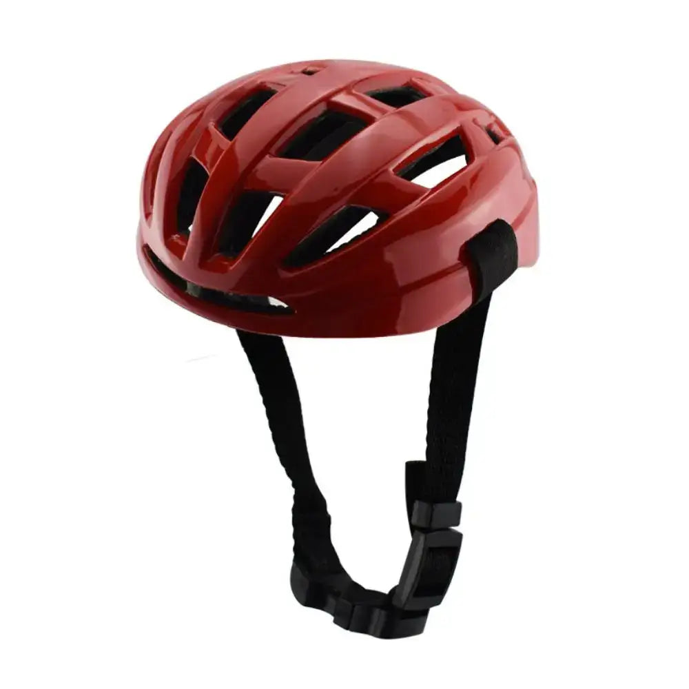 Red bicycle helmet with ventilation holes and black straps.