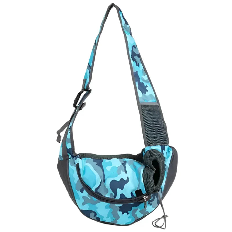 Blue camouflage patterned pet sling carrier bag with adjustable strap.