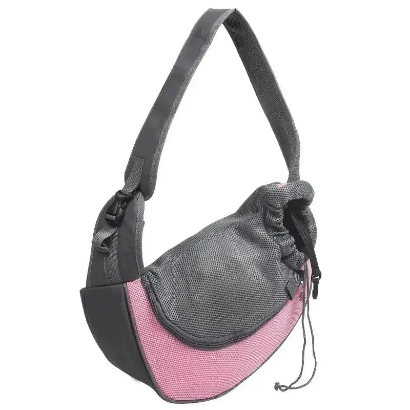 Pet carrier sling bag with pink and gray color scheme.